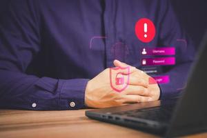 Man typing login and password, cyber security concept, Secure encryption and access to the user's private information to access the Internet. exclamation mark. photo