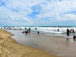 Chennai, India, December 2020, People enjoying beach life of chennai india photo