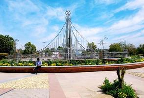 Chandigarh, December 2020. A boy sitting and using a mobile at pushpa gujral science city photo