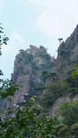 The beautiful mountains landscapes with the green forest and erupted rock cliff as background in the countryside of the China photo