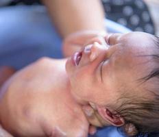 Cute little boy bathed by his mother Children are happy in the bathroom. photo