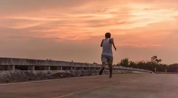 man with runner on the street be running for exercise. photo