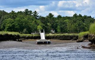 Wharf Resting on a Muddy Beach on a River photo