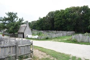 Thatched Houses and Fenced Pastures in a Colonial Village photo