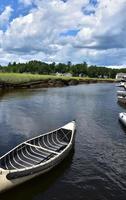 Stunning View of a Canoe on a Tidal River photo