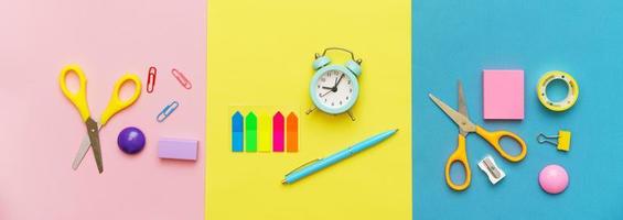 Various stationery for the school on a multi-colored background. Back to school photo