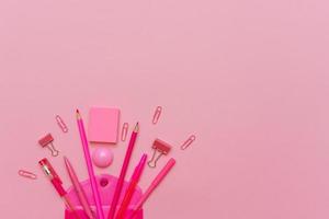 Supplies creative tools for school creative work on pink background stationery photo