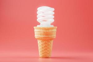 Energy-saving screw Light ice cream in a waffle cone on a pink background. photo