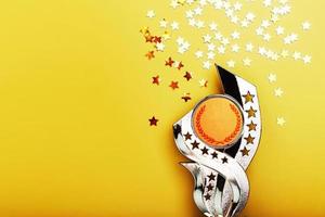 Gold Superprize with a scattering of stars on a yellow background with a copy of space. photo