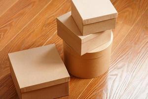 Boxes of parcels on a wooden background, free space. photo