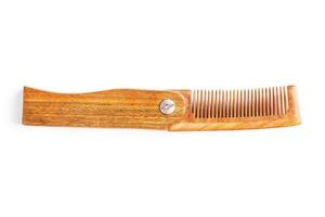 Wooden comb made of natural sandalwood for men on a white background. photo