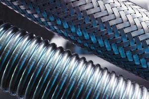 Corrugated metal hose for fuel supply, Close - up. photo