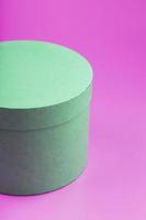 Round Box on pink background for gift. photo