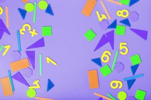 Colorful figures and numbers for children on a pink background. A tool for developing children's thinking. photo