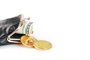 Black classic wallet with dollars and bitcoin coins on a white background. photo