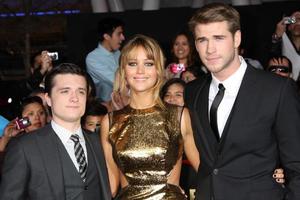 LOS ANGELES, MAR 12 - Josh Hutcherson Jennifer Lawrence Liam Hemsworth arrives at the Hunger Games Premiere at the Nokia Theater at LA Live on March 12, 2012 in Los Angeles, CA photo