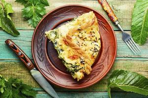 Cheese pie with spinach, top view photo