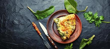 Cheese pie with spinach, copy space photo