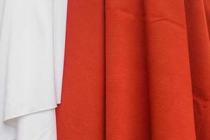 Samples of cloth and fabrics in different colors found at a fabrics market photo