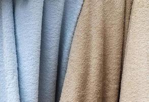 Samples of cloth and fabrics in different colors found at a fabrics market photo