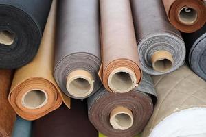 Samples of cloth and fabrics in different colors found at a fabrics market photo