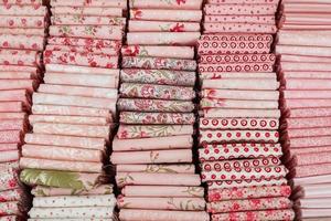 Samples of cloth and fabrics in different colors found at a fabrics market photo