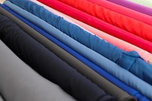 Samples of cloth and fabrics in different colors found at a fabrics market photo