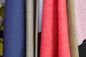 Samples of cloth and fabrics in different colors found at a fabrics market photo