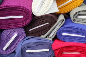 Samples of cloth and fabrics in different colors found at a fabrics market photo