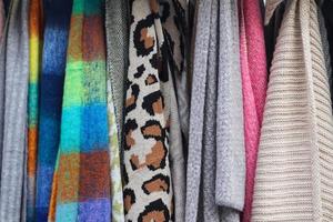 Samples of cloth and fabrics in different colors found at a fabrics market photo