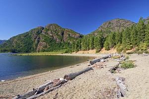 Wilderness beach on a mountain Lake photo