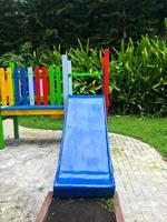 Modern Playground Equipment. Modern Colorful kids playground on yard in the park photo