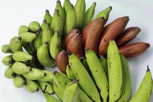 Banana on white background. Healthful banana collection. Ripe bunch of bananas photo