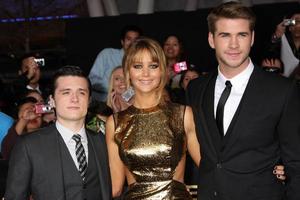 LOS ANGELES, MAR 12 - Josh Hutcherson Jennifer Lawrence Liam Hemsworth arrives at the Hunger Games Premiere at the Nokia Theater at LA Live on March 12, 2012 in Los Angeles, CA photo