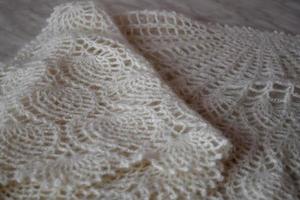 White knitted shawl close-up. Orenburg downy shawl photo