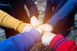 females hands together for unity photo