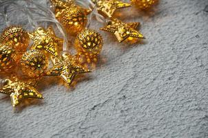 Shining Christmas golden ball and stars with customizable space for text. Copy space. photo