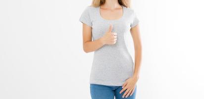 T shirt template. Girl showing big thumb up gesture sign isolated on white background. Body language. Copy space and mock up. Cropped image photo