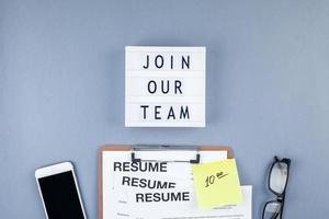 Join our team flat lay on blue background photo