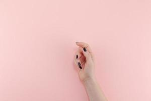 Woman's hands with black manicure photo