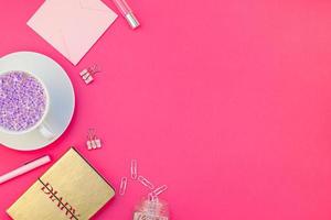 Styled pink feminine workspace flat lay photo