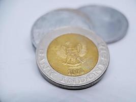 One thousand rupiah coin from Indonesia with the palm oil symbol isolated on white background, Diterbitkan oleh bank Indonesia pada tahun 1993 photo