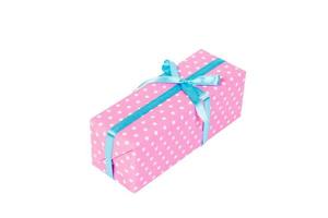 Christmas or other holiday handmade present in pink paper with blue ribbon. Isolated on white background, top view. thanksgiving Gift box concept photo