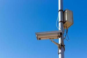 road Security camera on blue sky background photo