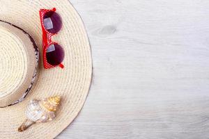 beach accessories on wooden board. Top view photo