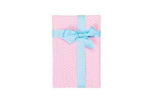 Christmas or other holiday handmade present in pink paper with blue ribbon. Isolated on white background, top view. thanksgiving Gift box concept photo