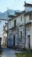 The beautiful traditional Chinese village view with the classical architecture and fresh green trees as background photo