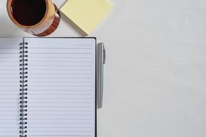 Top view of notebook, paper note,  juice photo