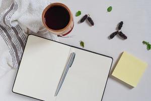 Top view of notebook, paper note, mulberry juice photo