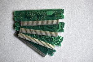 Old electronic boards for retro games. Cartridges for retro game consoles. photo